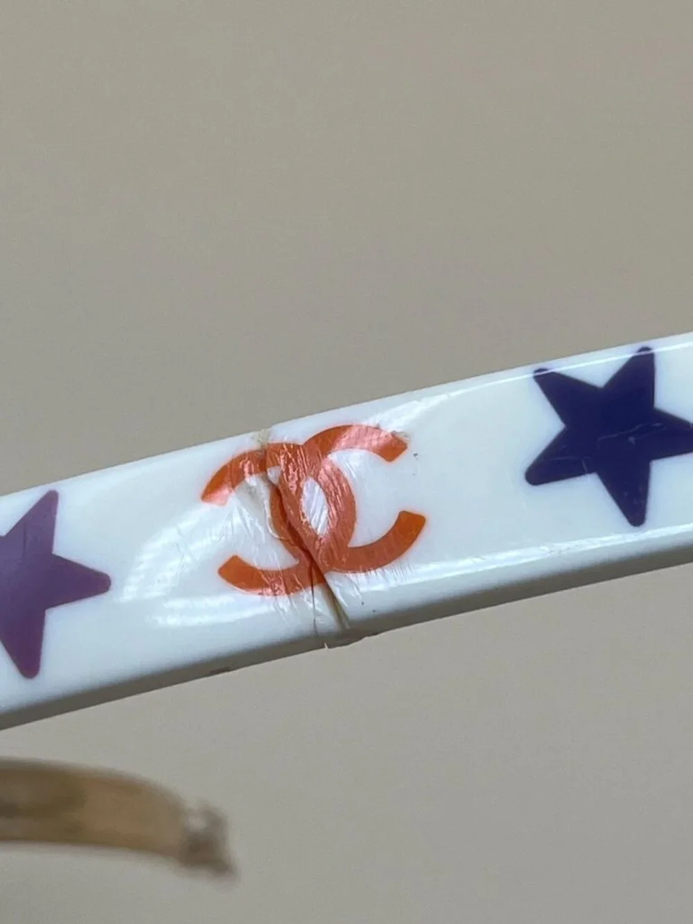 Authentic vintage Chanel bar barrette in cream-white resin, printed with two red